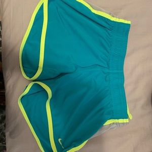 neon green and teal dri fit athletic nike shorts